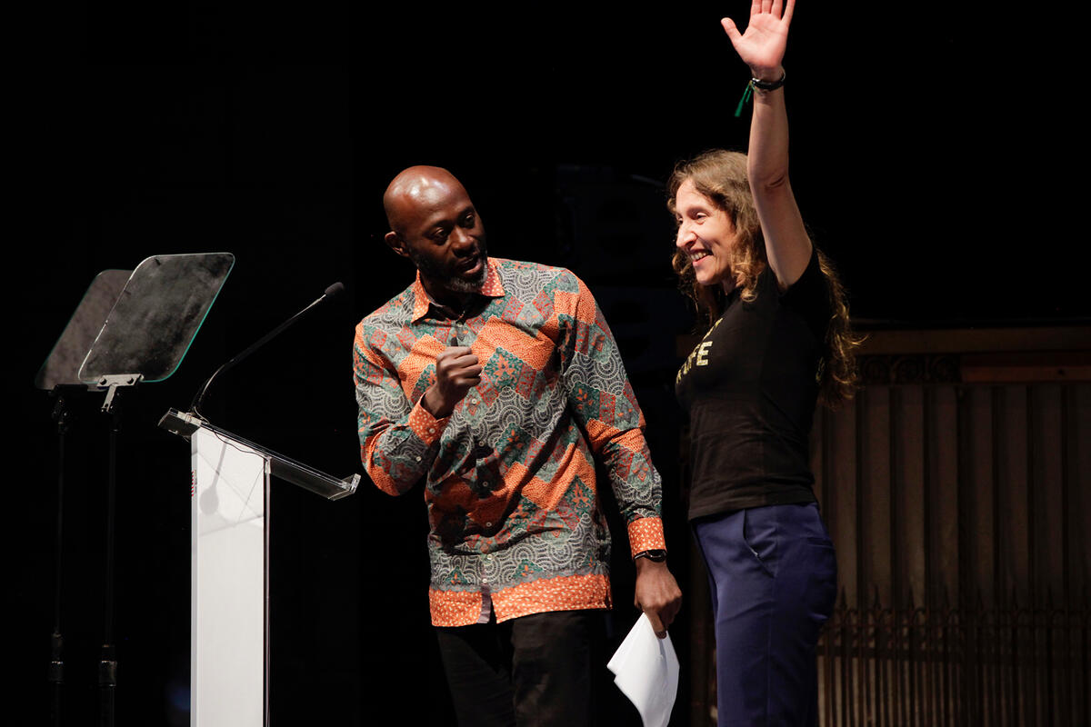 <p>Master of ceremonies Henry Bonsu introduces speaker Valeriia Rachynska, a Ukrainian HIV activist working with 100% Life, a Global Fund implementing partner. The Global Fund/Tim Knox</p>