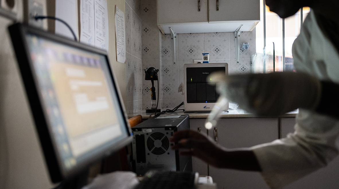 Stephanie Mukandayisaba, a lab technician, demonstrates a TB sample processing using a GeneXpert machine at the Gisenyi District Hospital lab. Health workers fighting the Ebola epidemic that swept West Africa several years ago waited days or weeks for the results of laboratory tests to detect the deadly virus. But in the latest outbreak in DRC, this waiting time has shrunk to hours thanks to a test involving the GeneXpert machine, which is widely used across Africa to diagnose tuberculosis. (Nichole Sobecki / VII for the Global Fund)