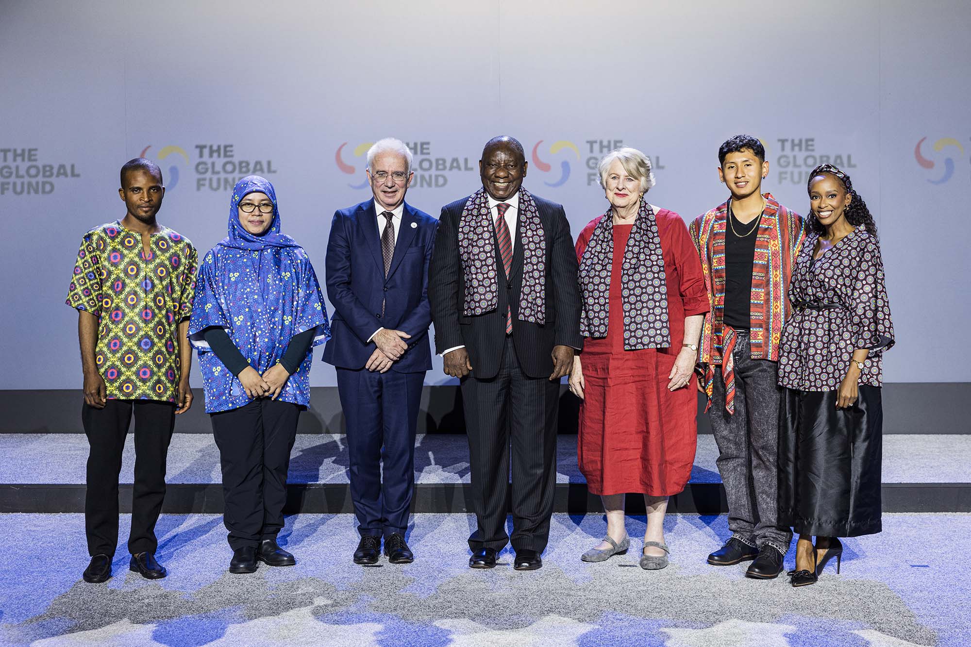 Global Fund partners demonstrate unity and resolve to sustain the fight against AIDS, tuberculosis (TB) and malaria, save millions more lives, and strengthen systems for health at the Global Fund’s Eighth Replenishment Summit in Johannesburg, South Africa, which was held on 21 November, 2025, on the margins of the G20 Leaders’ Summit. From left to right: Nuradeen Zakariyya, entrepreneur and advocate for universal health coverage; Ani Herna Sari, TB advocate and chair of the Rekat Peduli Indonesia Foundation; Global Fund Executive Director Peter Sands; South African President Cyril Ramaphosa; Global Fund Board Chair Lady Roslyn Morauta; Ivan Molina Aranibar, HIV advocate and Global Fund Youth Council member; and Sibulele Sibaca Nomnganga, global health advocate and social change engineer.
